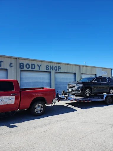 A vehicle delivered on the flatbed to a body shop