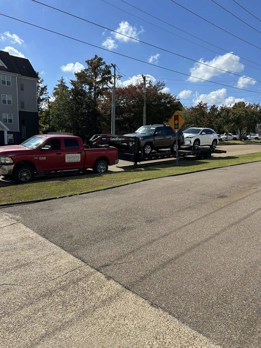 A vehicle loaded on the trailer on a residential street