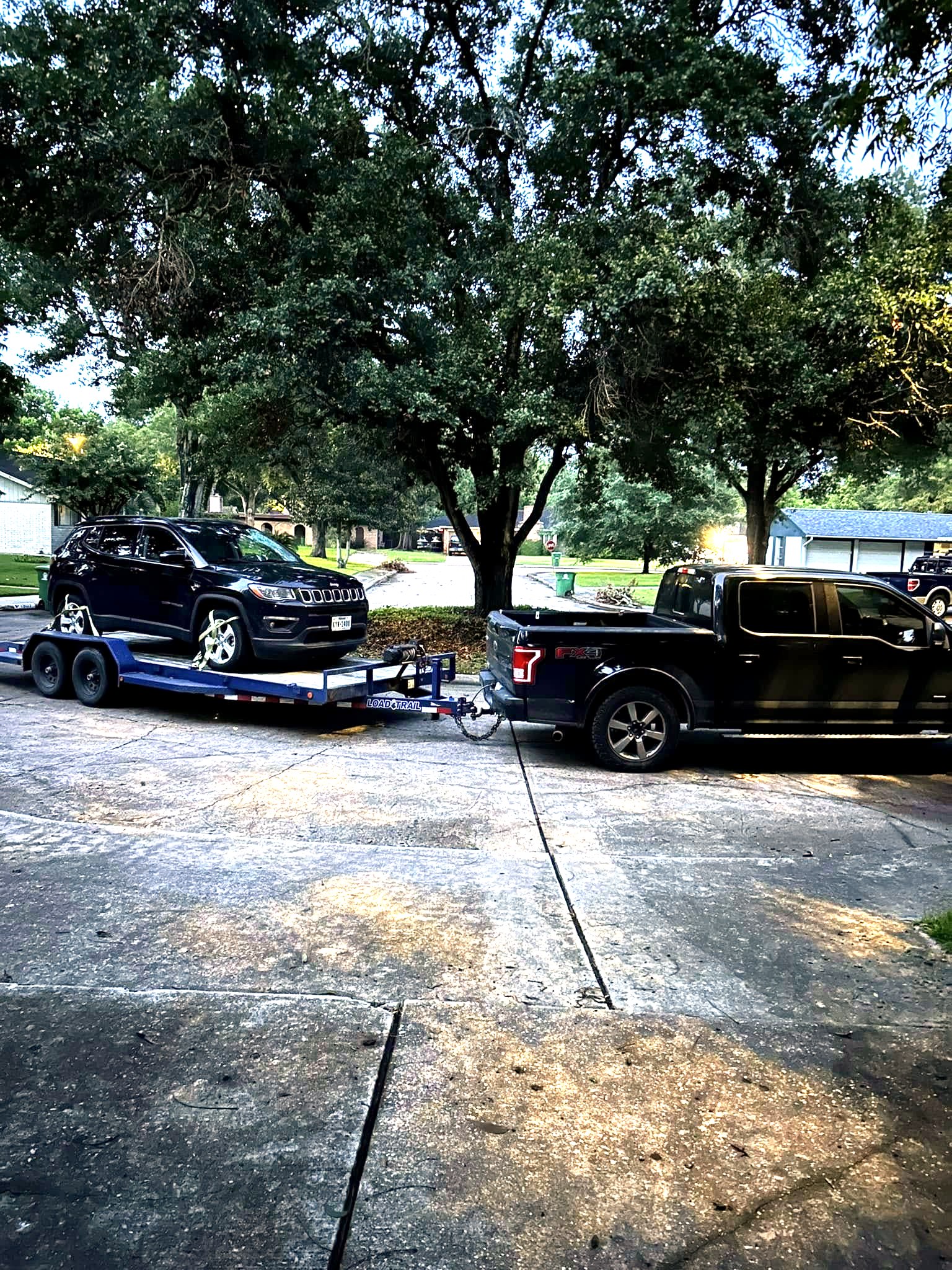 Some Of It All truck with a vehicle loaded for transport